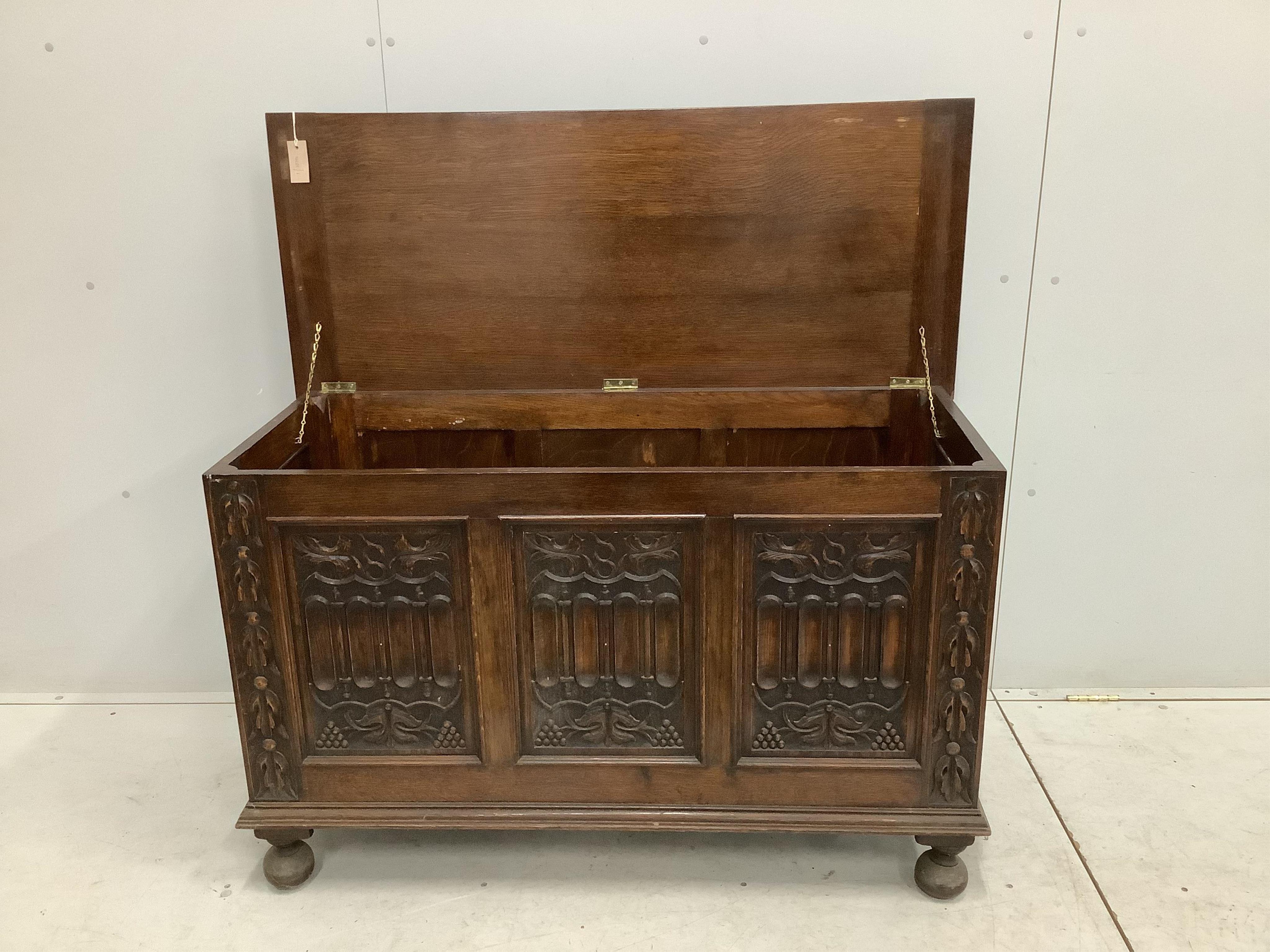 A 17th century style carved oak coffer, width 121cm, depth 52cm, height 76cm. Condition - fair